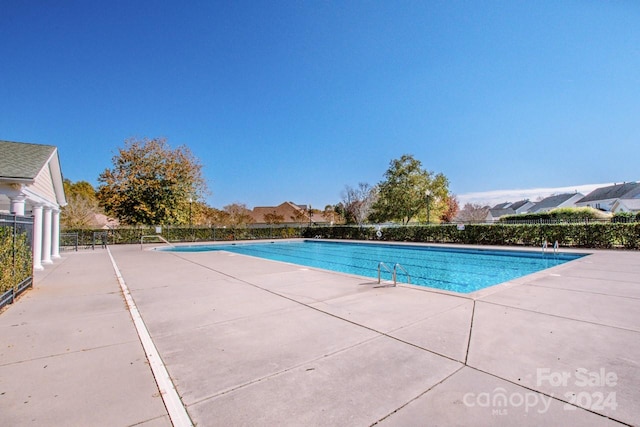 view of swimming pool featuring a patio