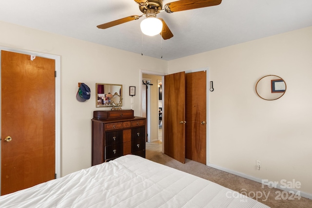 carpeted bedroom featuring ceiling fan