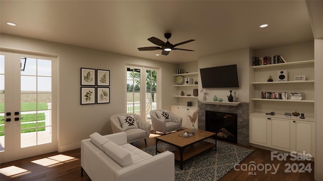 living room with a fireplace, french doors, dark hardwood / wood-style floors, and ceiling fan