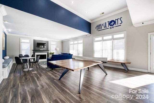 playroom with crown molding, wood-type flooring, and a healthy amount of sunlight