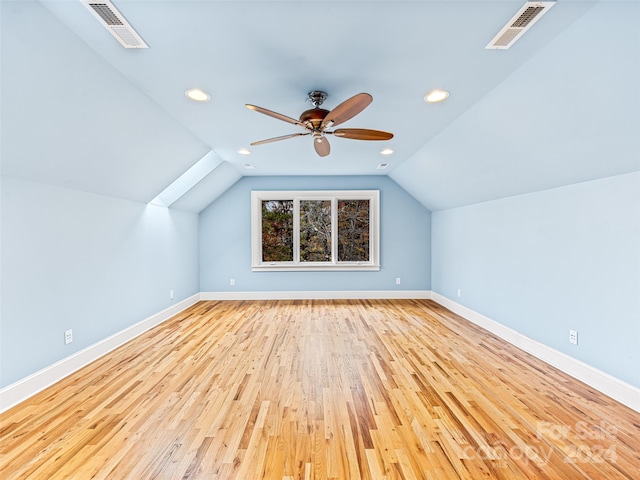 bonus room with light hardwood / wood-style floors, ceiling fan, and lofted ceiling