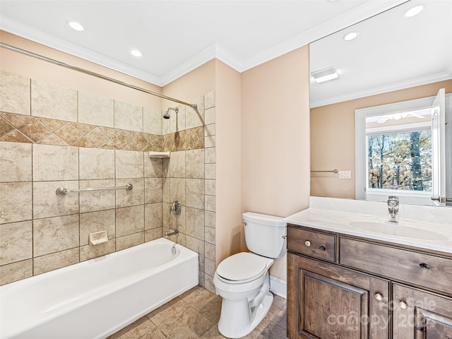 full bathroom with tiled shower / bath, ornamental molding, vanity, tile patterned floors, and toilet