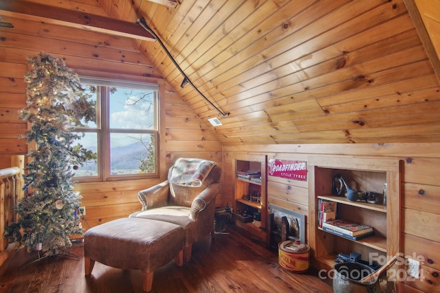 sitting room featuring wood ceiling, wood walls, wood-type flooring, and vaulted ceiling