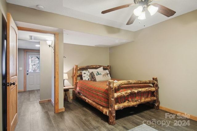 bedroom featuring dark wood-type flooring and ceiling fan