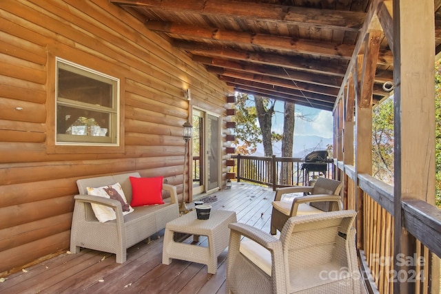 sunroom with wood ceiling and lofted ceiling with beams