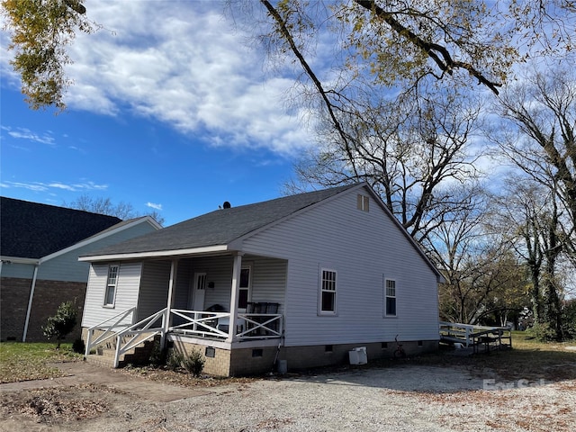 922 N Main St, Salisbury, NC 28144 - back of house featuring crawl space, covered porch, and roof with shingles