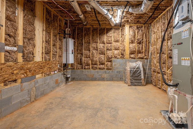 6630 Vesuvius Furnace Rd Unit 1, Denver, NC 28037 - unfinished basement featuring water heater, heating unit, and concrete block wall