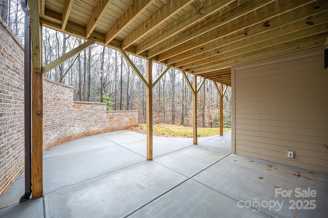 6630 Vesuvius Furnace Rd Unit 1, Denver, NC 28037 - view of patio featuring a forest view