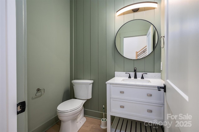 6630 Vesuvius Furnace Rd Unit 1, Denver, NC 28037 - bathroom with baseboards, toilet, wood finished floors, and vanity