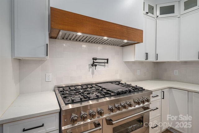 6630 Vesuvius Furnace Rd Unit 1, Denver, NC 28037 - kitchen featuring backsplash, glass insert cabinets, double oven range, custom exhaust hood, and white cabinetry