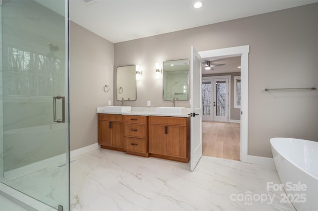 6630 Vesuvius Furnace Rd Unit 1, Denver, NC 28037 - full bath with marble finish floor, a sink, a marble finish shower, french doors, and a freestanding bath