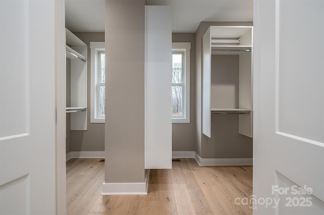 6630 Vesuvius Furnace Rd Unit 1, Denver, NC 28037 - walk in closet featuring wood finished floors