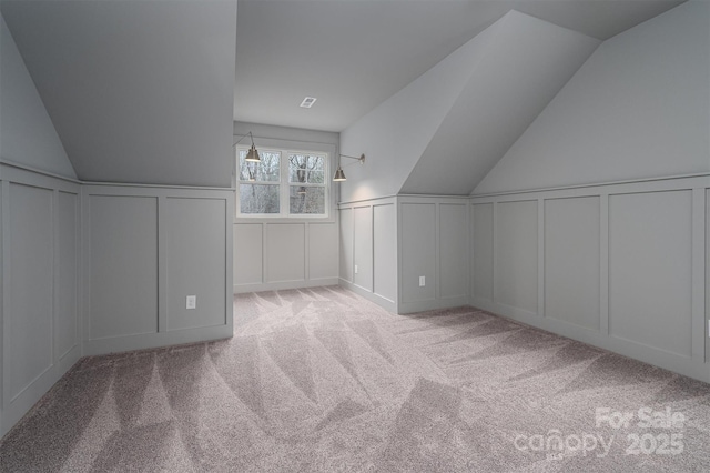 6630 Vesuvius Furnace Rd Unit 1, Denver, NC 28037 - bonus room featuring vaulted ceiling, a decorative wall, and carpet