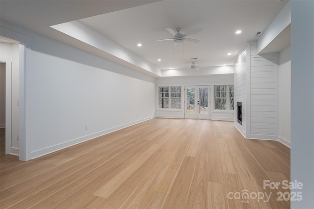 6630 Vesuvius Furnace Rd Unit 1, Denver, NC 28037 - unfurnished living room featuring light wood-style flooring, a ceiling fan, recessed lighting, a fireplace, and baseboards
