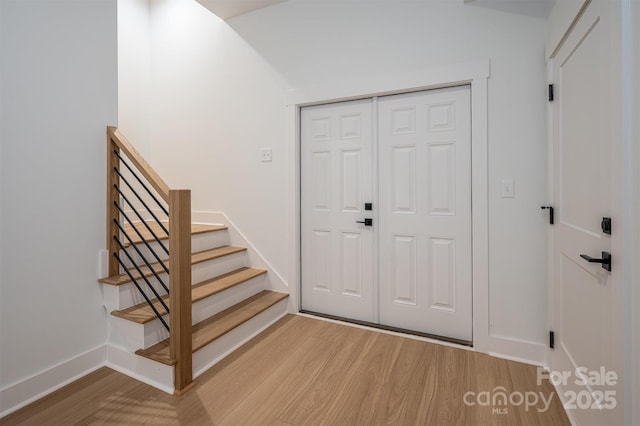 6630 Vesuvius Furnace Rd Unit 1, Denver, NC 28037 - entryway with stairway, light wood-style floors, and baseboards