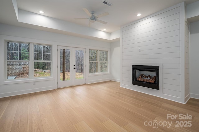 6630 Vesuvius Furnace Rd Unit 1, Denver, NC 28037 - unfurnished living room featuring light wood-type flooring, visible vents, baseboards, and a fireplace