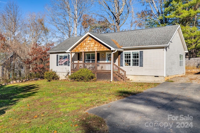 view of front of property with a porch and a front yard