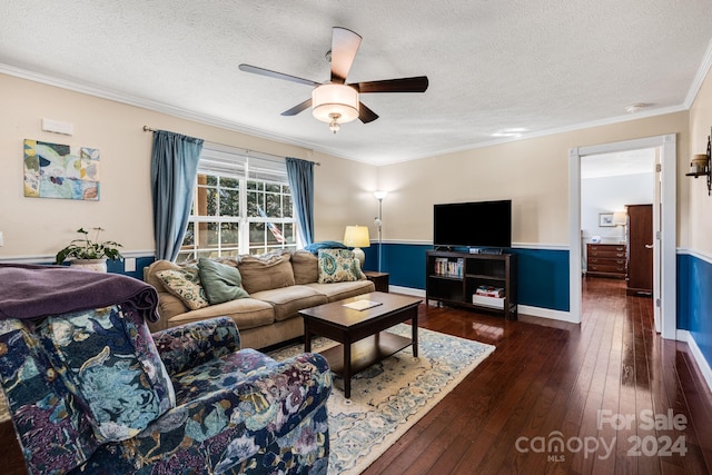 living room featuring crown molding, ceiling fan, dark wood-type flooring, and a textured ceiling