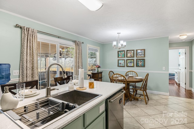 kitchen featuring sink, hanging light fixtures, stainless steel dishwasher, light tile patterned floors, and a chandelier