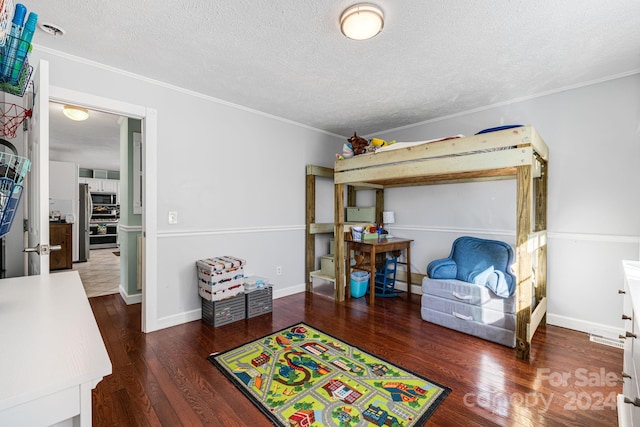 interior space featuring a textured ceiling, dark hardwood / wood-style floors, and crown molding