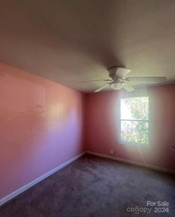 empty room with carpet and ceiling fan