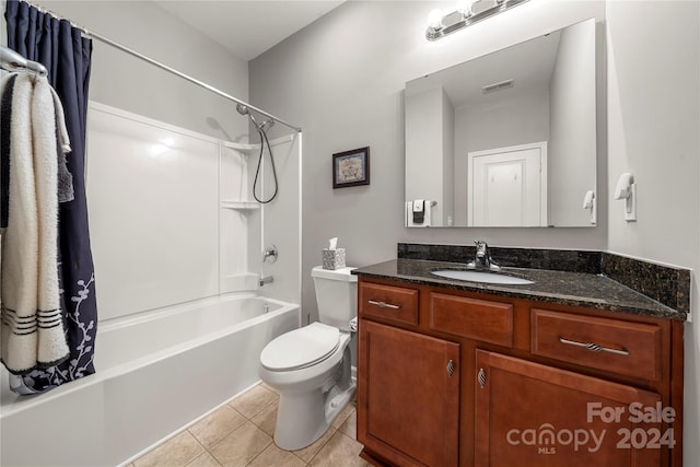 full bathroom with vanity, shower / tub combo, toilet, and tile patterned floors