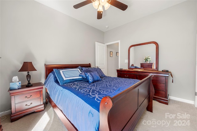 bedroom featuring light carpet and ceiling fan