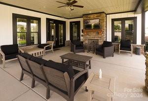 view of patio / terrace featuring an outdoor living space, french doors, and ceiling fan