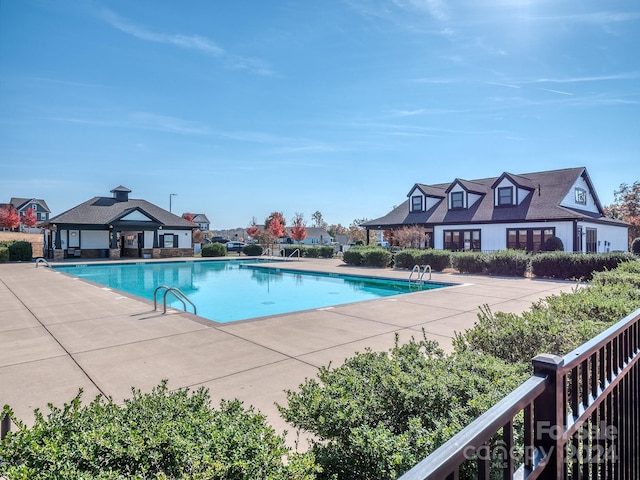 view of swimming pool with a patio