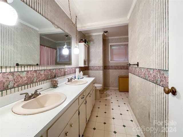 bathroom featuring crown molding, vanity, and toilet