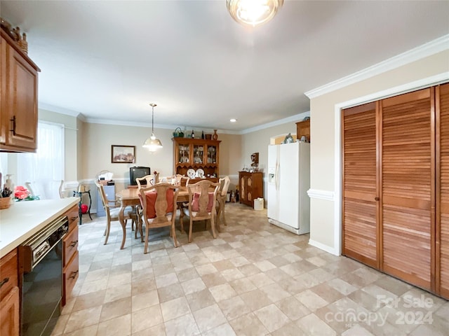 dining room featuring crown molding