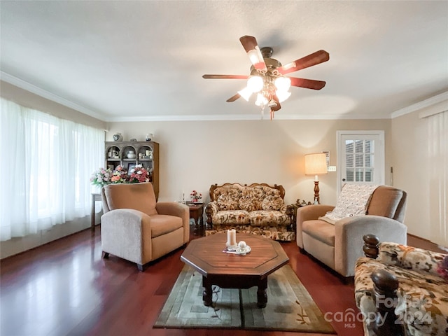 living room with ornamental molding, ceiling fan, and dark hardwood / wood-style floors