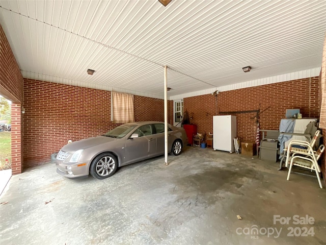 garage with white refrigerator