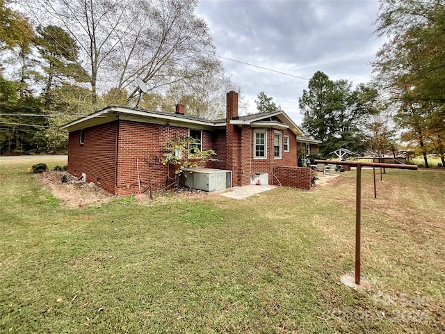 rear view of house with a lawn