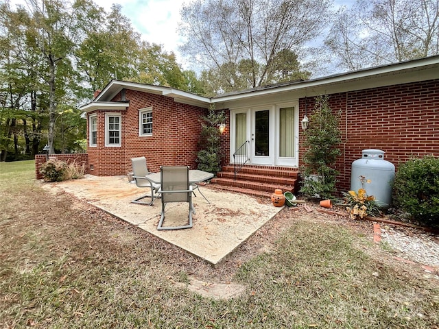 rear view of property featuring a patio