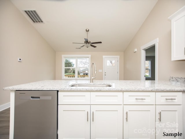 kitchen with lofted ceiling, white cabinets, sink, stainless steel dishwasher, and ceiling fan