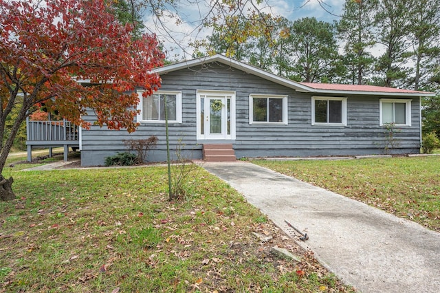 ranch-style house featuring a front yard