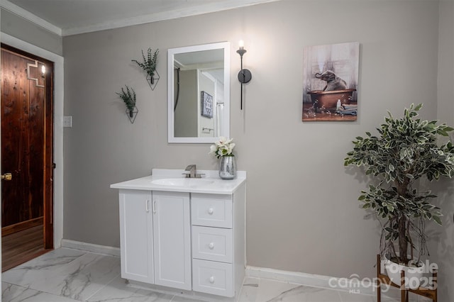 bathroom featuring marble finish floor, baseboards, ornamental molding, and vanity