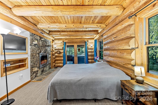 bedroom with a fireplace, multiple windows, and rustic walls