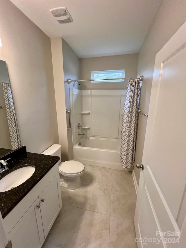 full bathroom with toilet, shower / bath combo, vanity, and tile patterned flooring