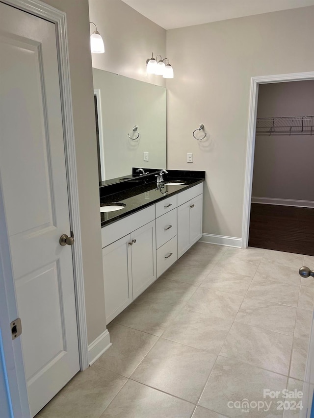 bathroom featuring vanity and tile patterned floors