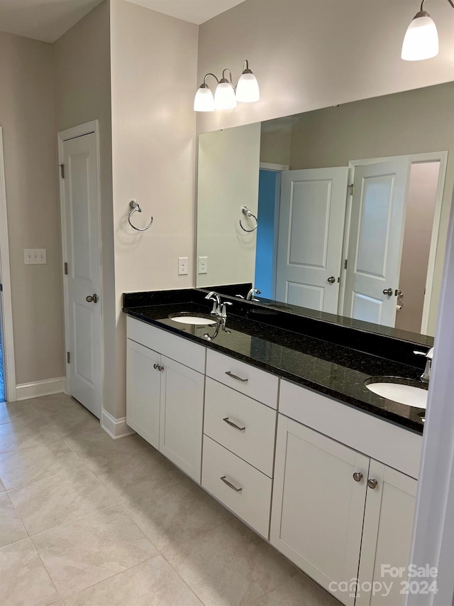 bathroom featuring vanity and tile patterned flooring