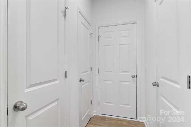 hall with light wood-type flooring