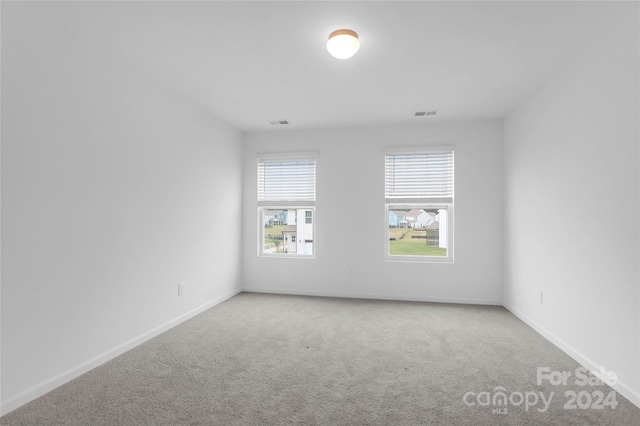 unfurnished room featuring carpet floors