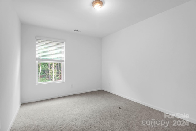 empty room with carpet flooring