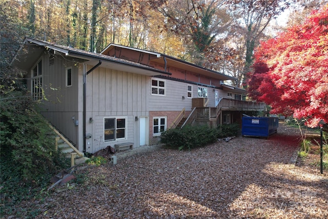 rear view of property featuring a deck