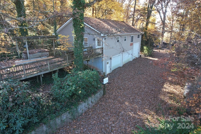 view of property exterior featuring a deck