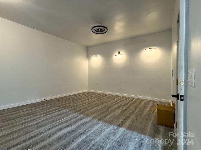 empty room featuring dark hardwood / wood-style flooring