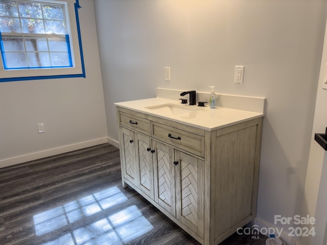 bathroom with vanity and hardwood / wood-style flooring