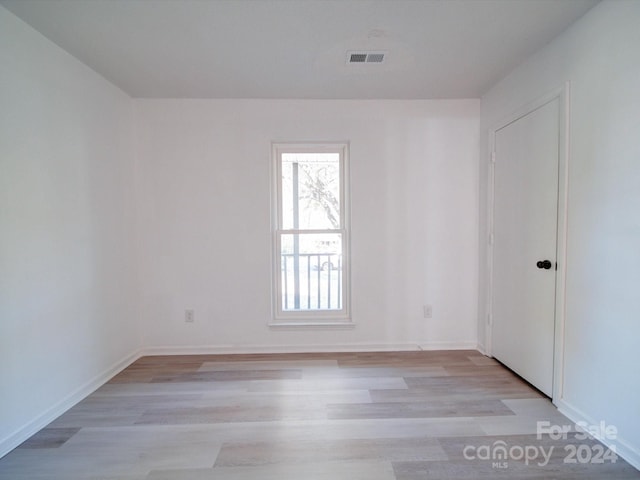 unfurnished room with light hardwood / wood-style flooring